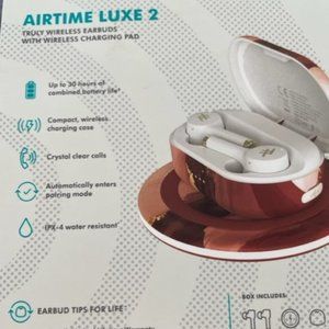 Airtime Luxe 2 wireless earbuds with charging pad
